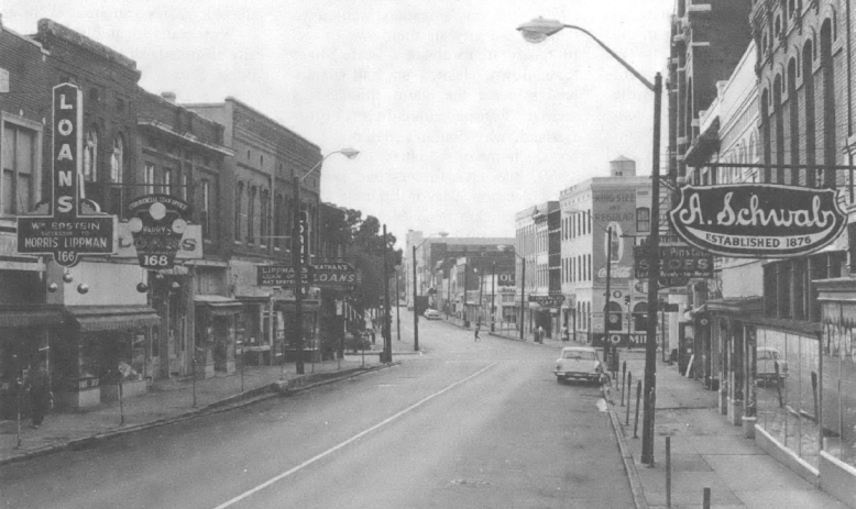 Black and white photo of looking down the street