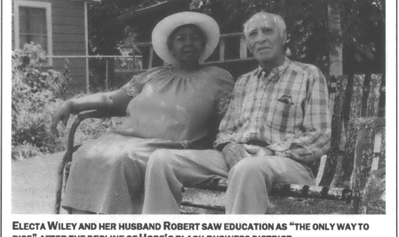 photograph portrait of a man and woman sit on a rocking bench in a backyard 