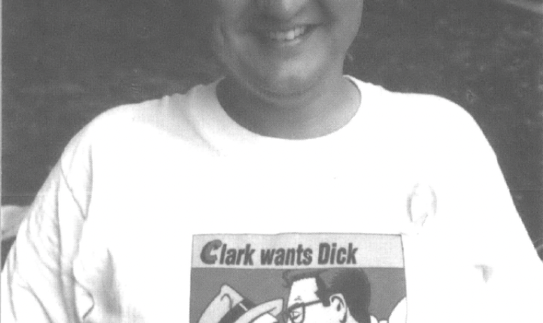 White man in t-shirt that reads "Clark wants Dick, Dick wants Condoms"