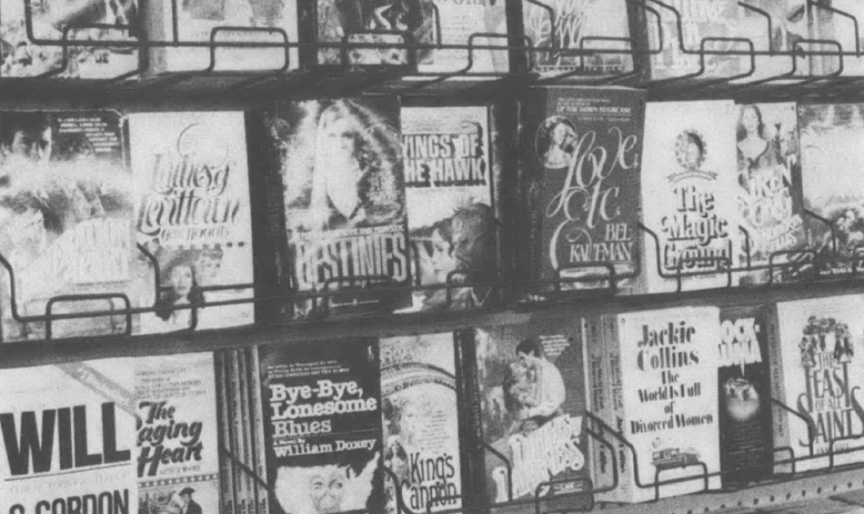 Black and white photo of bookshelf at bookstore