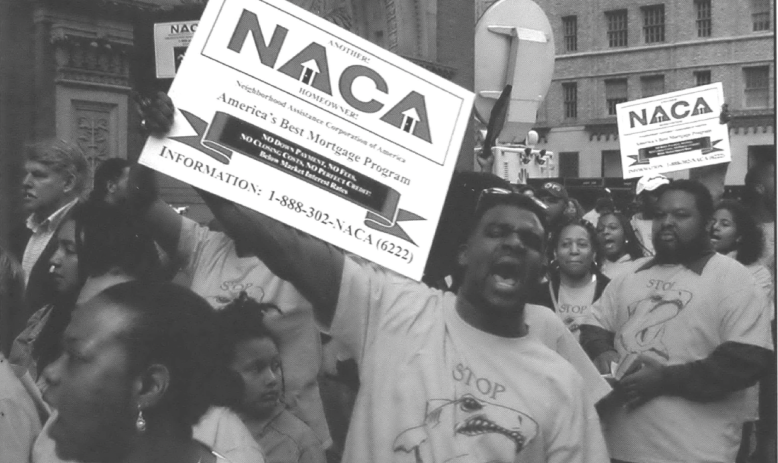 Protestors in street holding signs