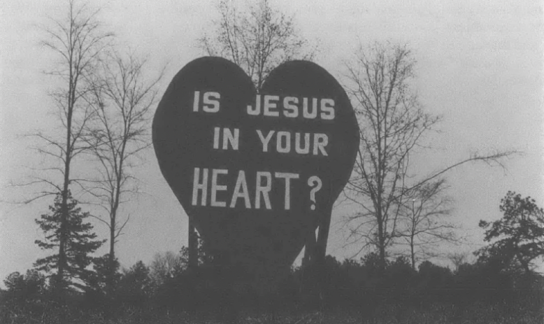 Photo of large heart on the side of the road that reads "Is Jesus In Your Heart?"
