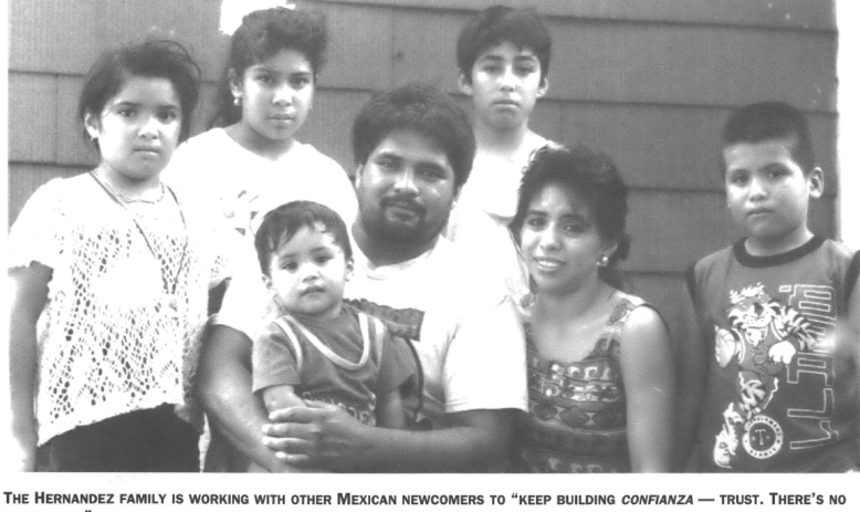 Family portrait with man holding small child 
