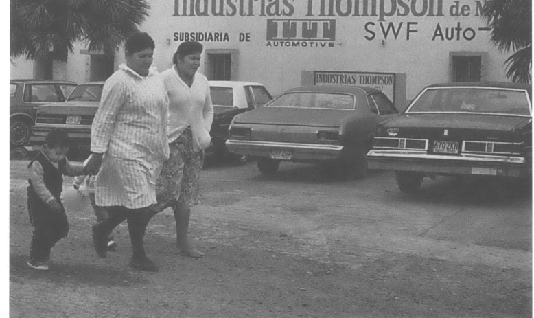 Workers leave a factory