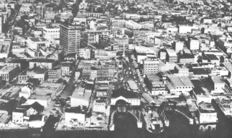 Black and white aerial overlook of city 