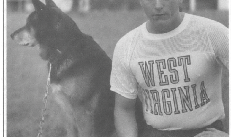 Bill Lee sitting next to dog