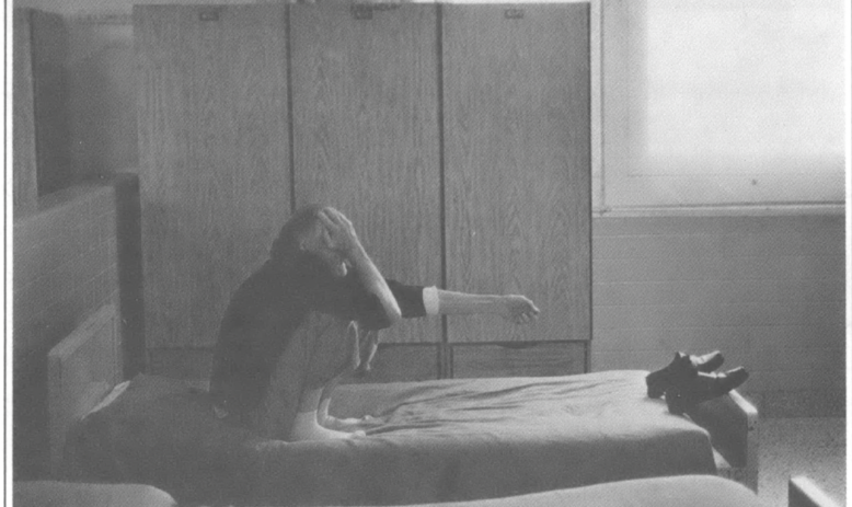 man alone on mental ospital bed