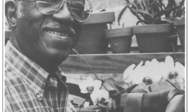 John Hope Franklin posing with orchids
