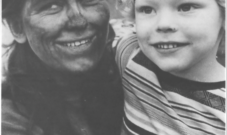 coal miner and child smiling