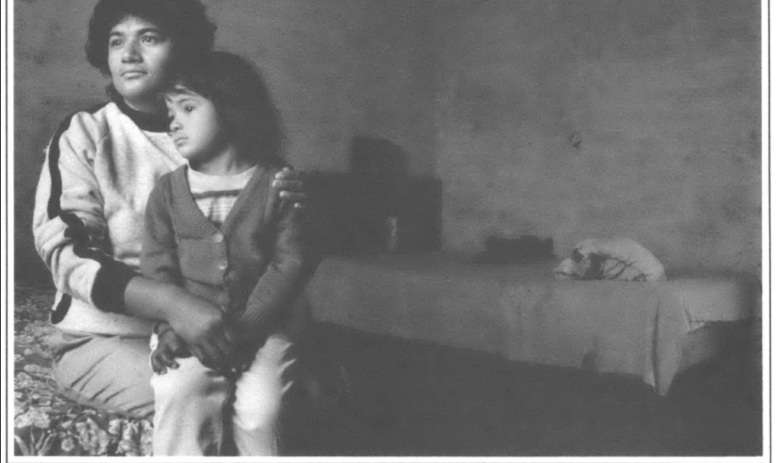 former at&t plant worker with child on her lap