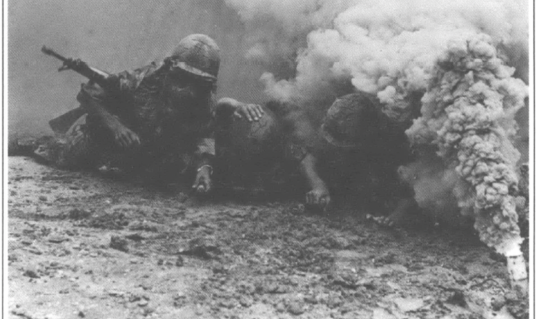 U.S. soldiers in war surrounded by smoke