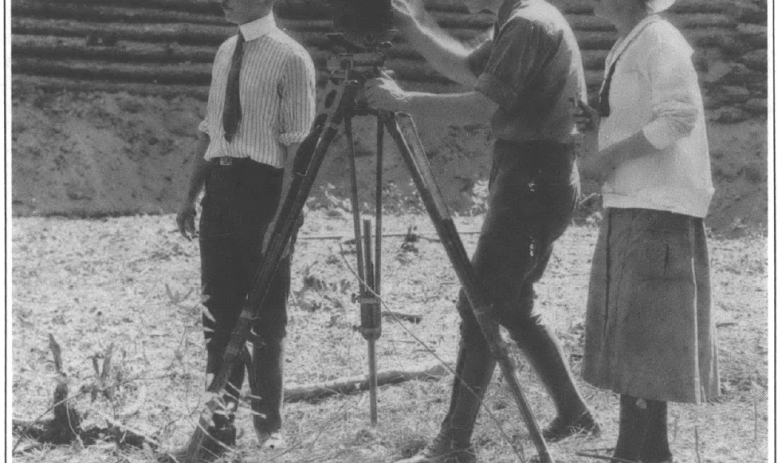 Three people filming a movie 