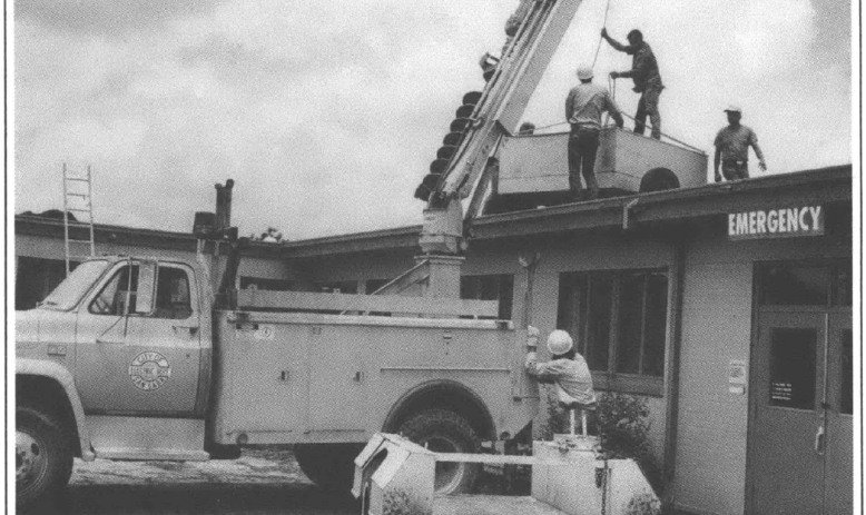 Utility truck in front of building 