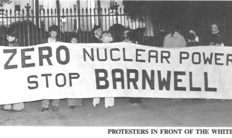 Black and White photo of protestors holding a banner reading, "Zero Nuclear Power Stop Barnwell."