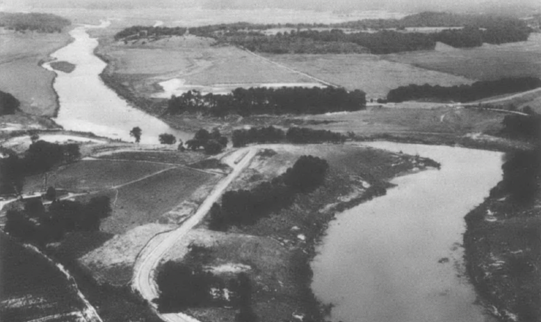 Black and white aerial photograph of a river valley