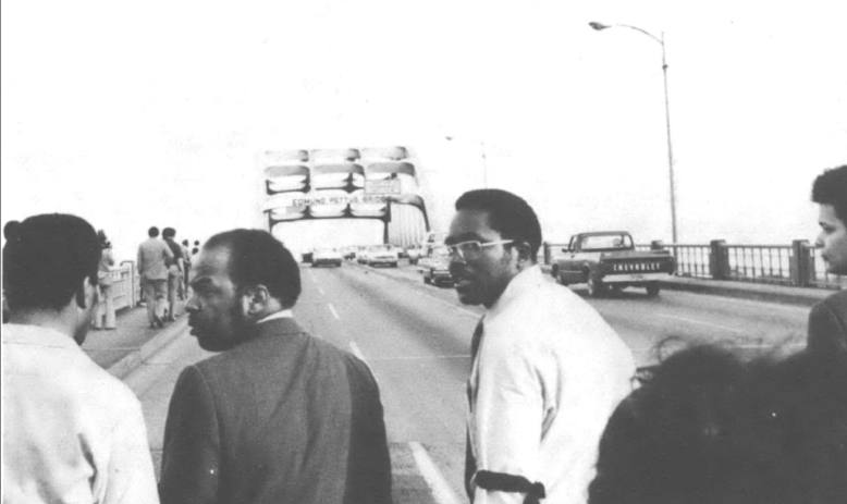 John Lewis, Fred Gray, Julian Bond march across bridge in Selma, Alabama