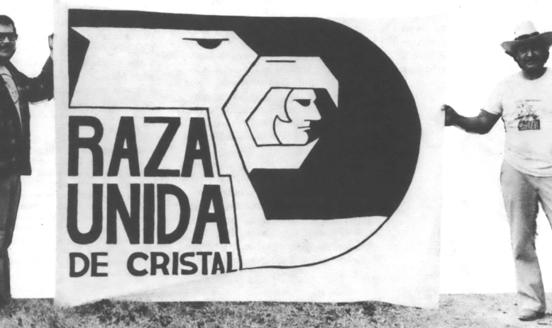 Two men holding a banner reading "Raza Unida de Cristal"