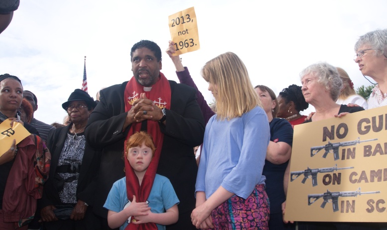 Rev. William Barber amidst Moral Monday protesters