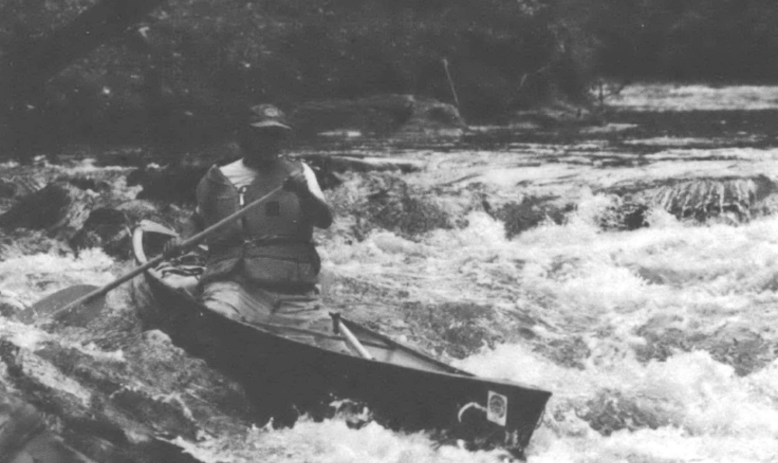 man on a boat on a river