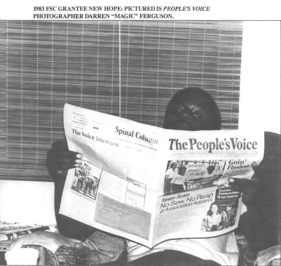 Black and white photo of Black man reading a newspaper