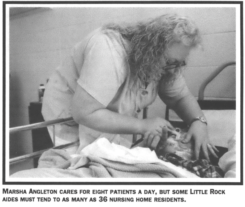 Nurse tending elderly patient