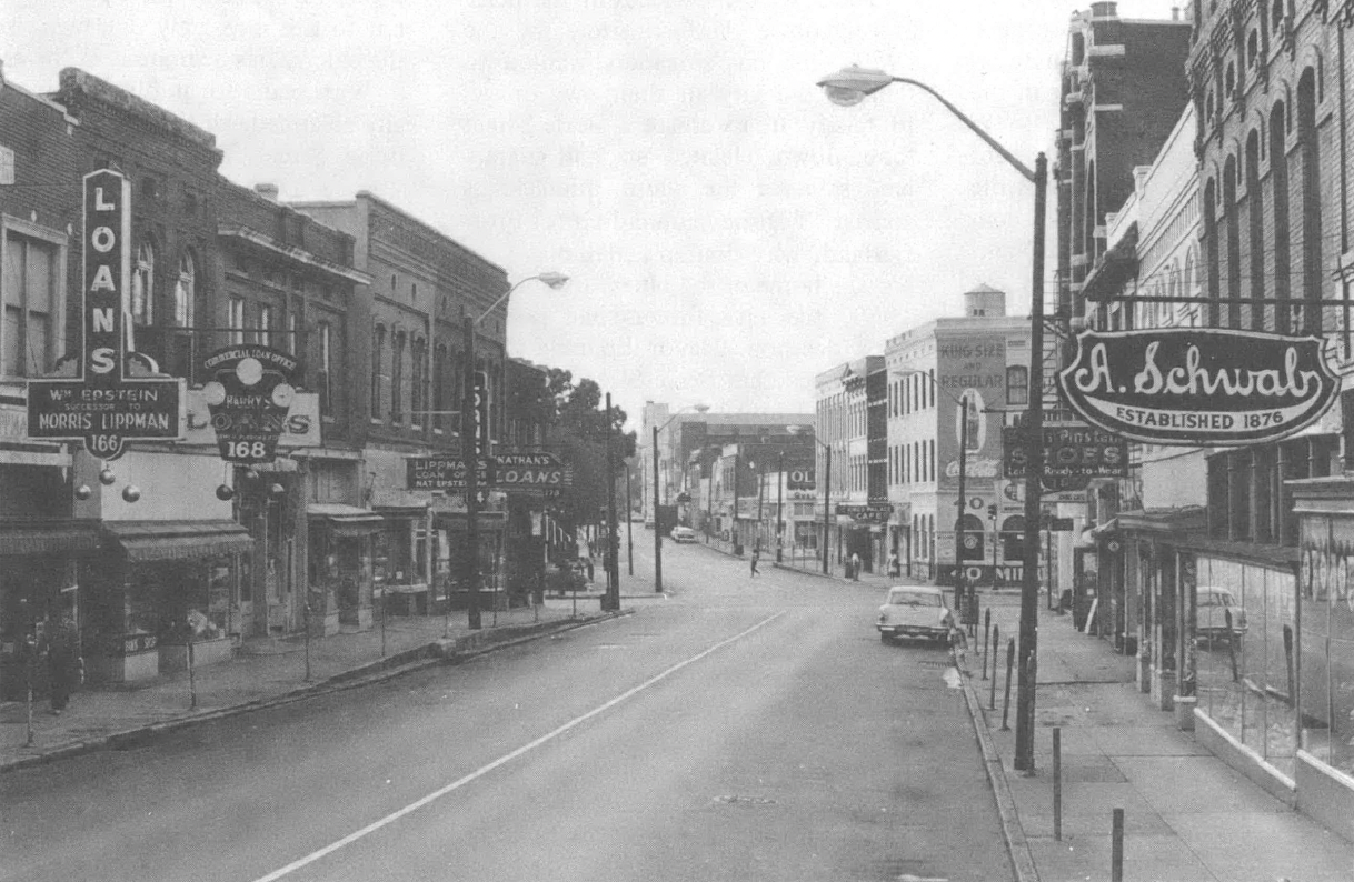 Black and white photo of looking down the street