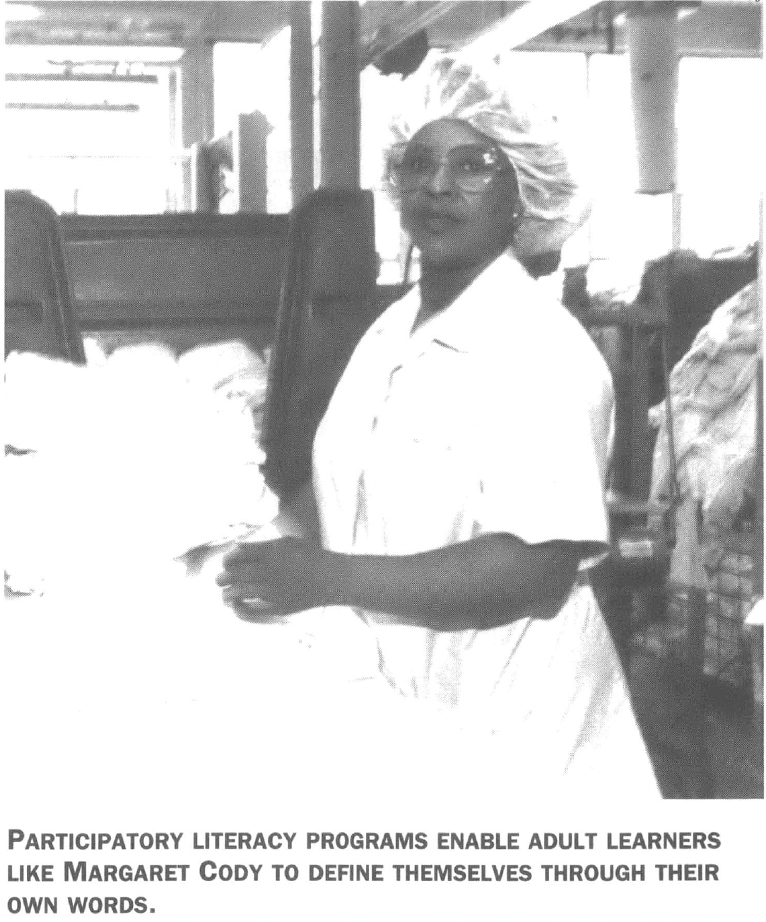 Line worker in hairnet, looking at the camera