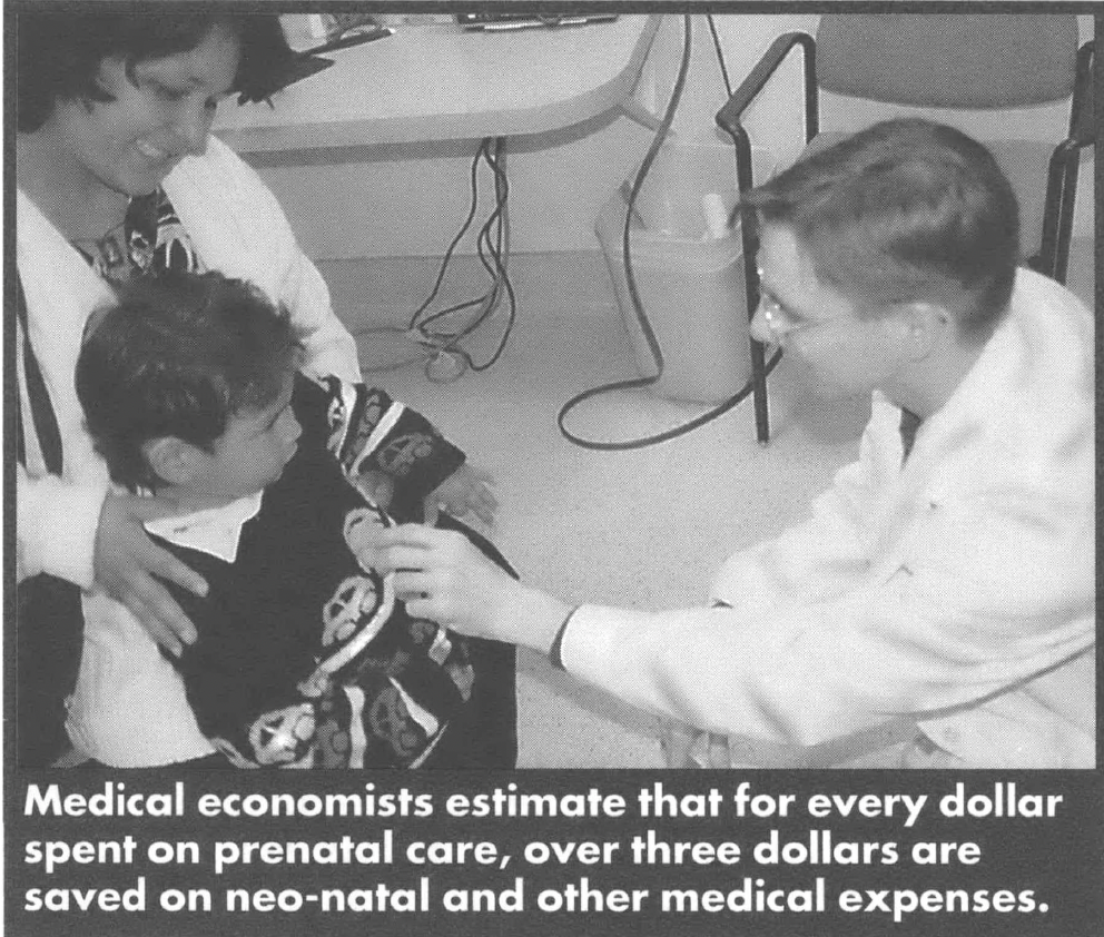 Doctor holding a stethoscope to a child's heart