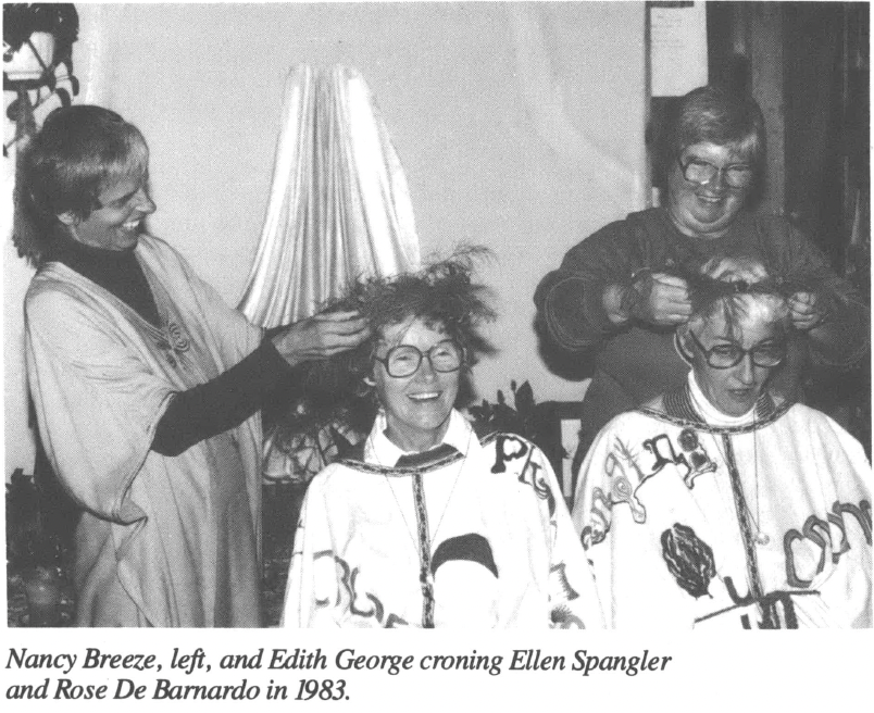 Photo of several white women smiling, one woman seated while others mess with her hair