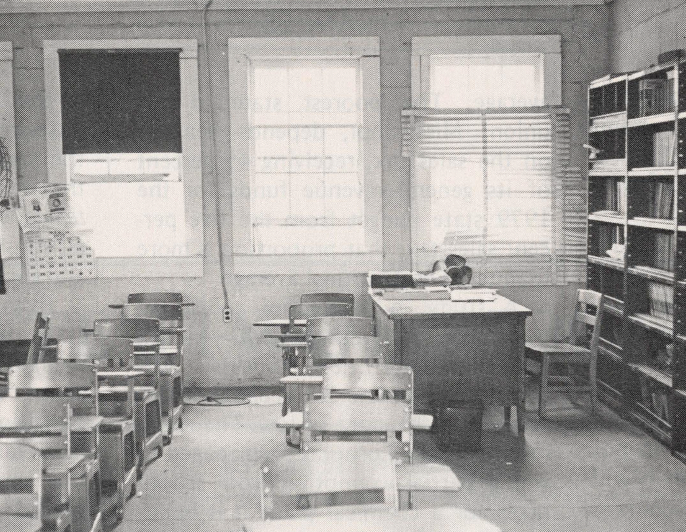 Black and white photo of empty classroom