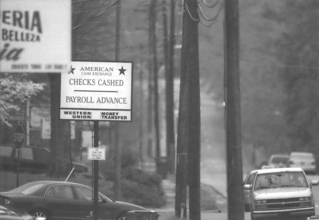 Sign that says Checks Cashed Payroll Advance