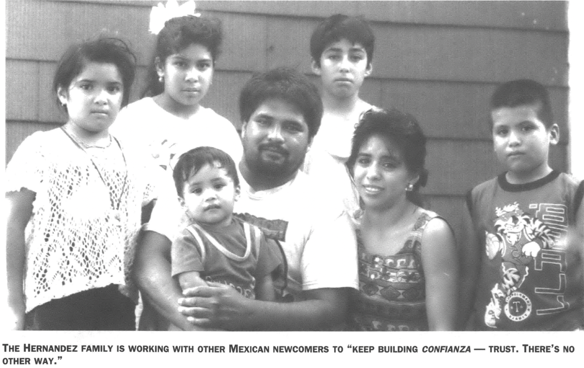 Family portrait with man holding small child 