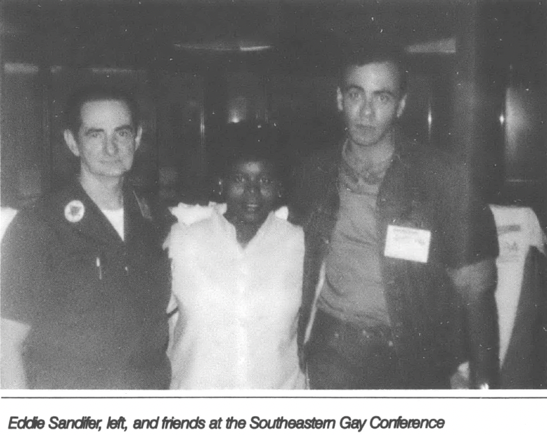 Picture of three people facing camera with arms around each other. Caption reads "Eddie Sandifer, left, and friends at the Southeastern Gay Conference"