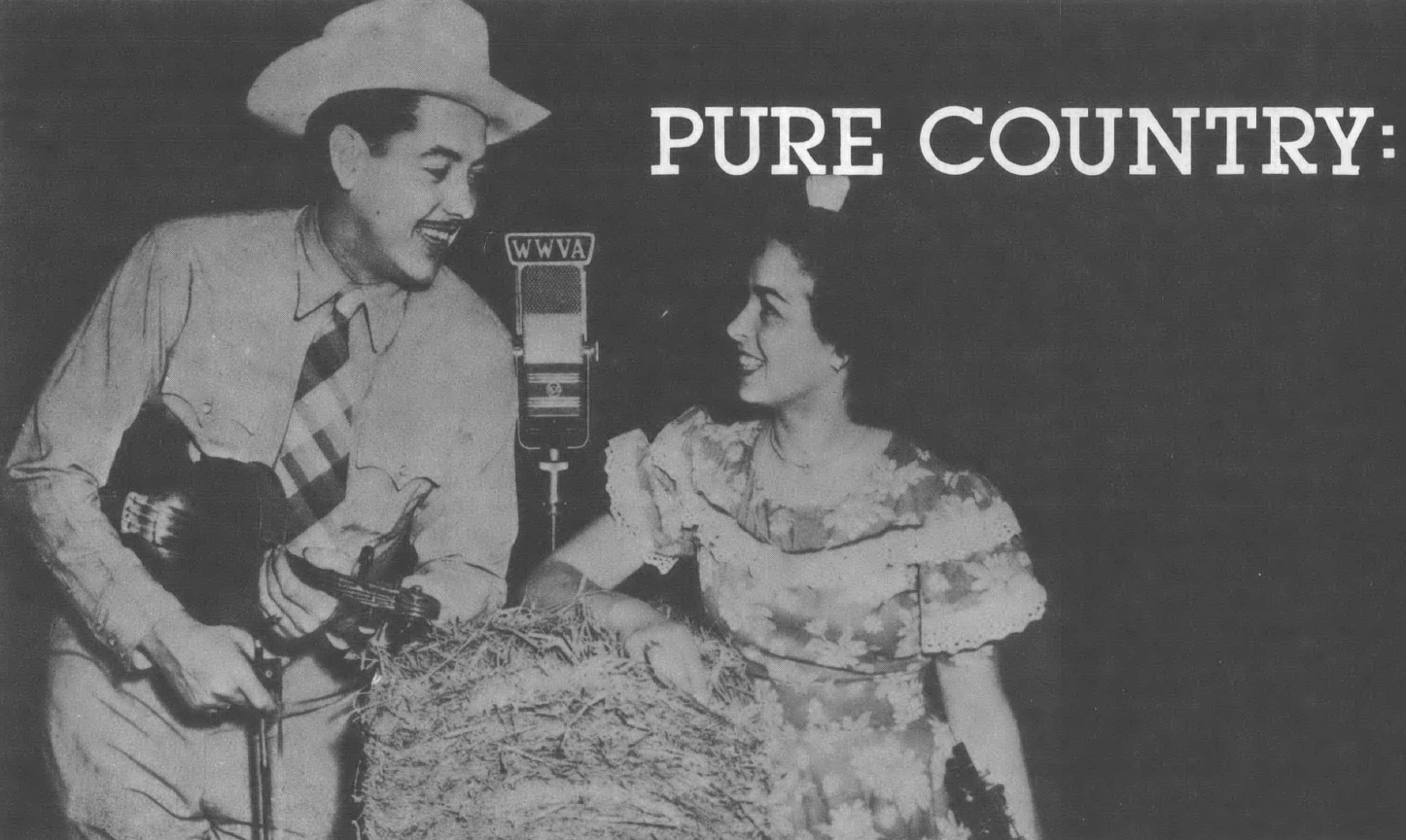 Black and white photo of man in cowboy hat holding fiddle and woman seated in floral dress singing into a microphone