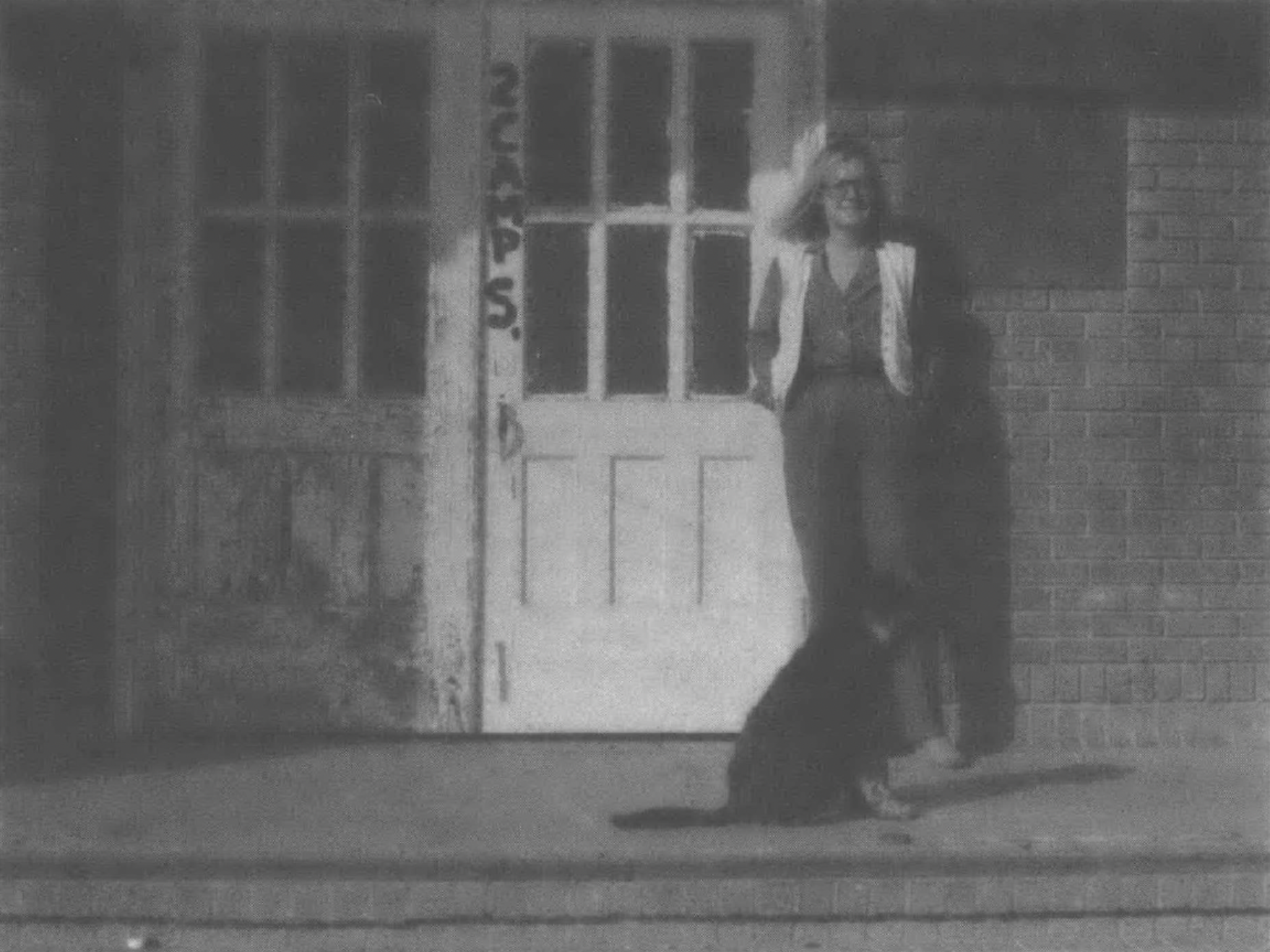 woman standing in front of doors