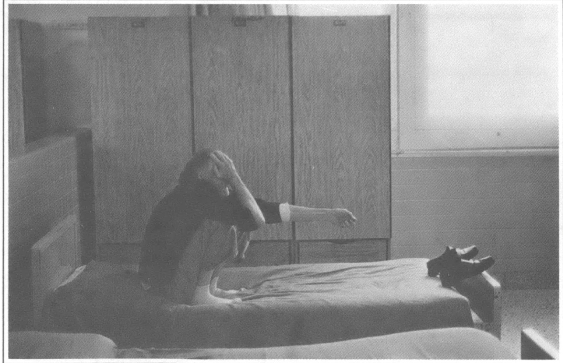 man alone on mental ospital bed