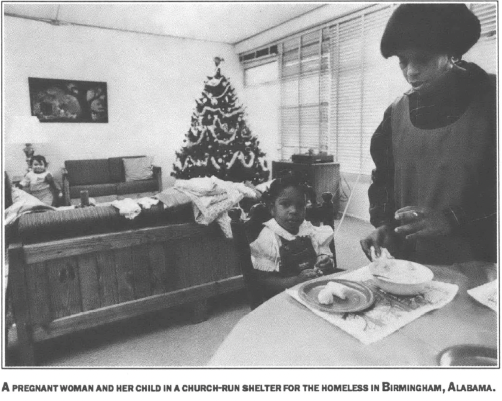 a pregnant woman and child in a church-run shelter