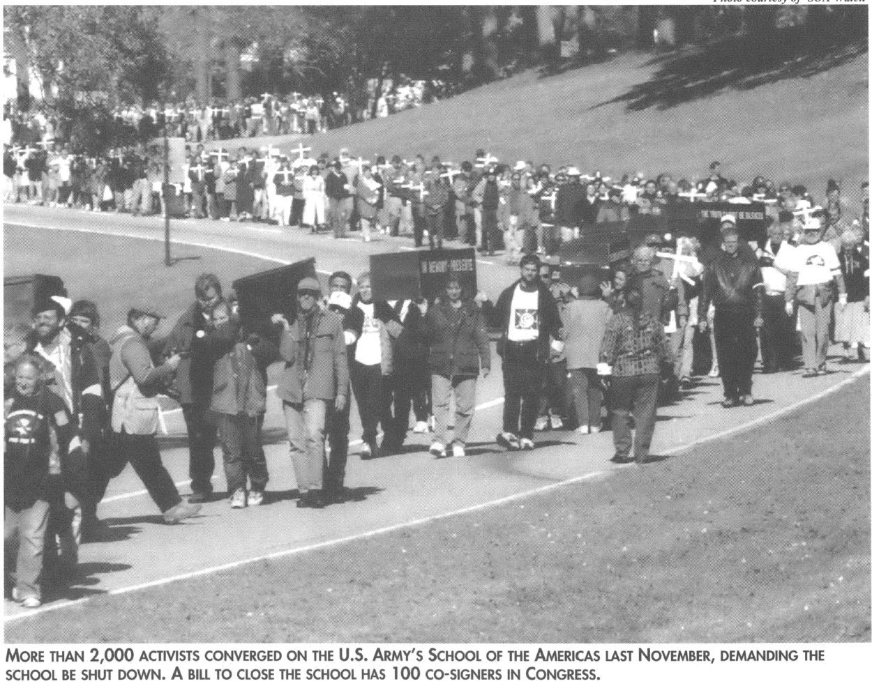 Protestors lining a road 