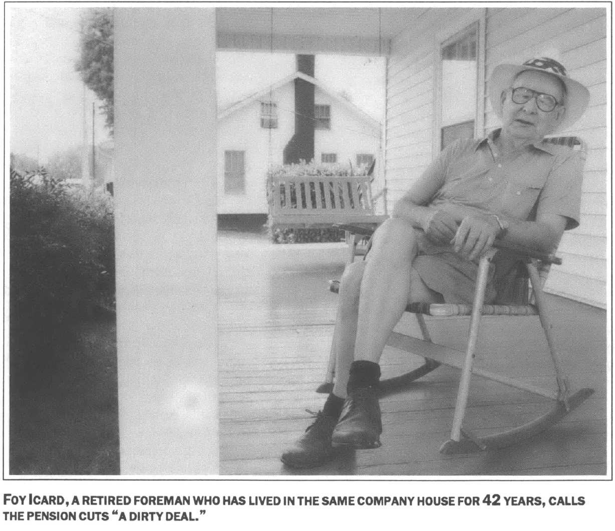 retired forman sits on a porch in a rocking chair wearing a hat 