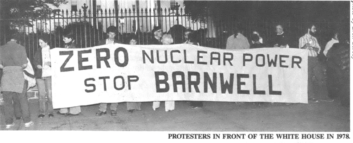 Black and White photo of protestors holding a banner reading, "Zero Nuclear Power Stop Barnwell."