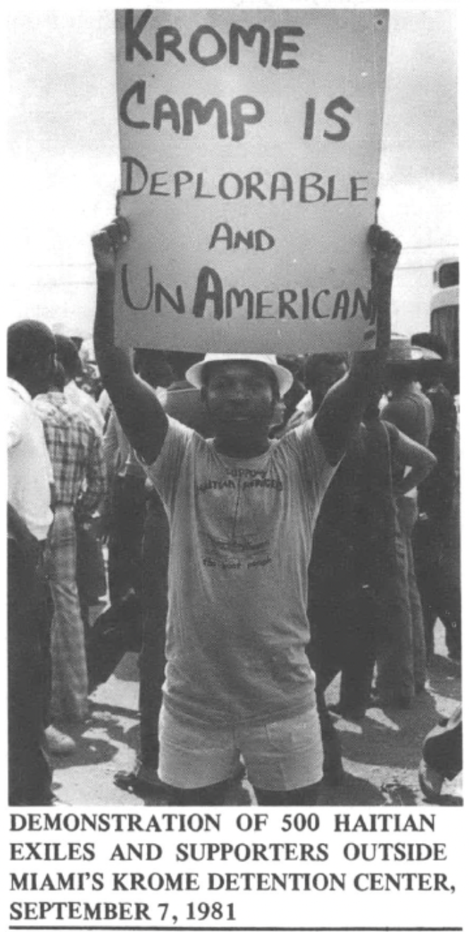 Haitian man holding sign at demonstration outside Miami's Krome Detention Center