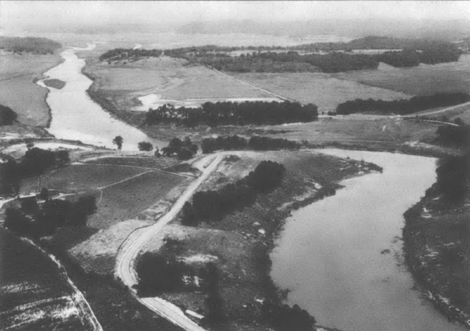 Black and white aerial photograph of a river valley