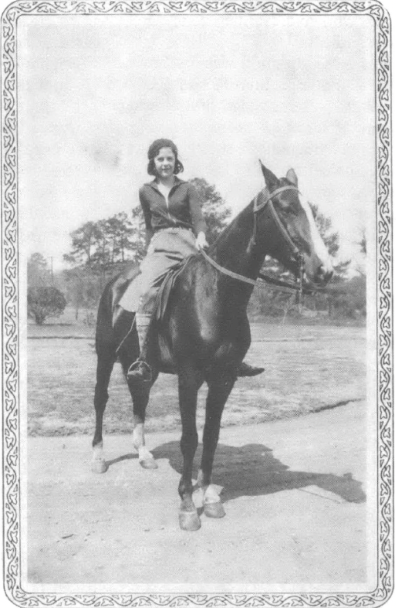 photograph of young woman on a horse