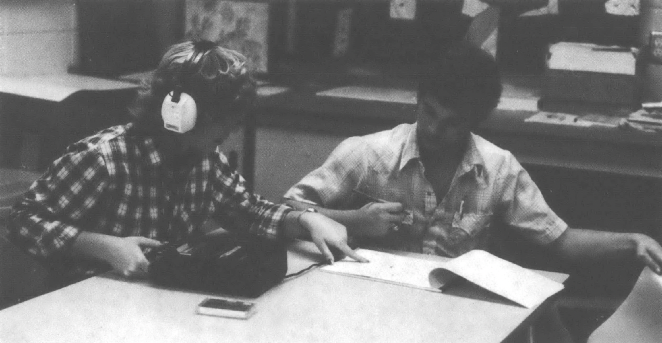 Pam Nix (left) and Randy McFalls check the transcription of an interview they did with Pam’s grandmother, Lillian Nix