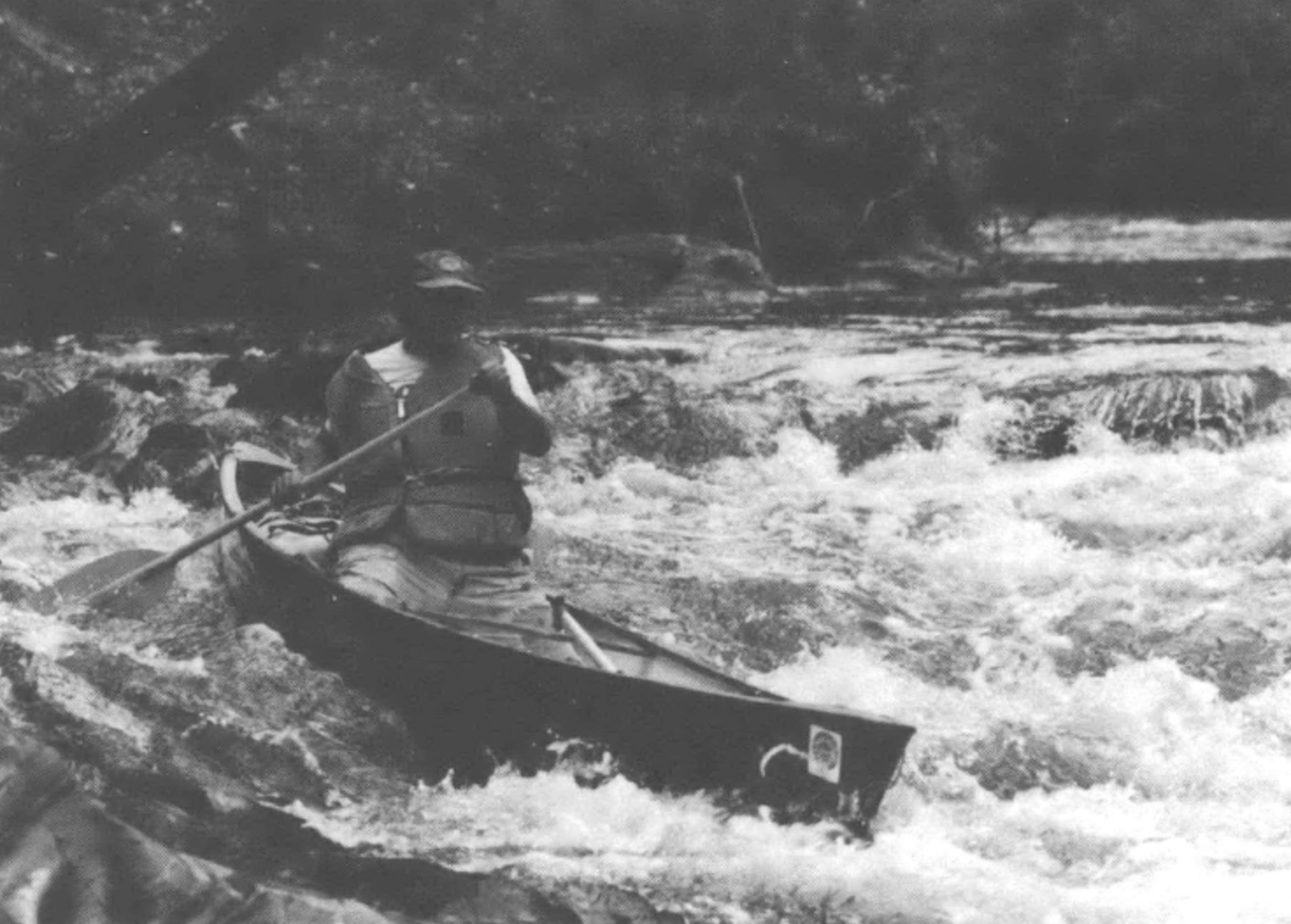 man on a boat on a river