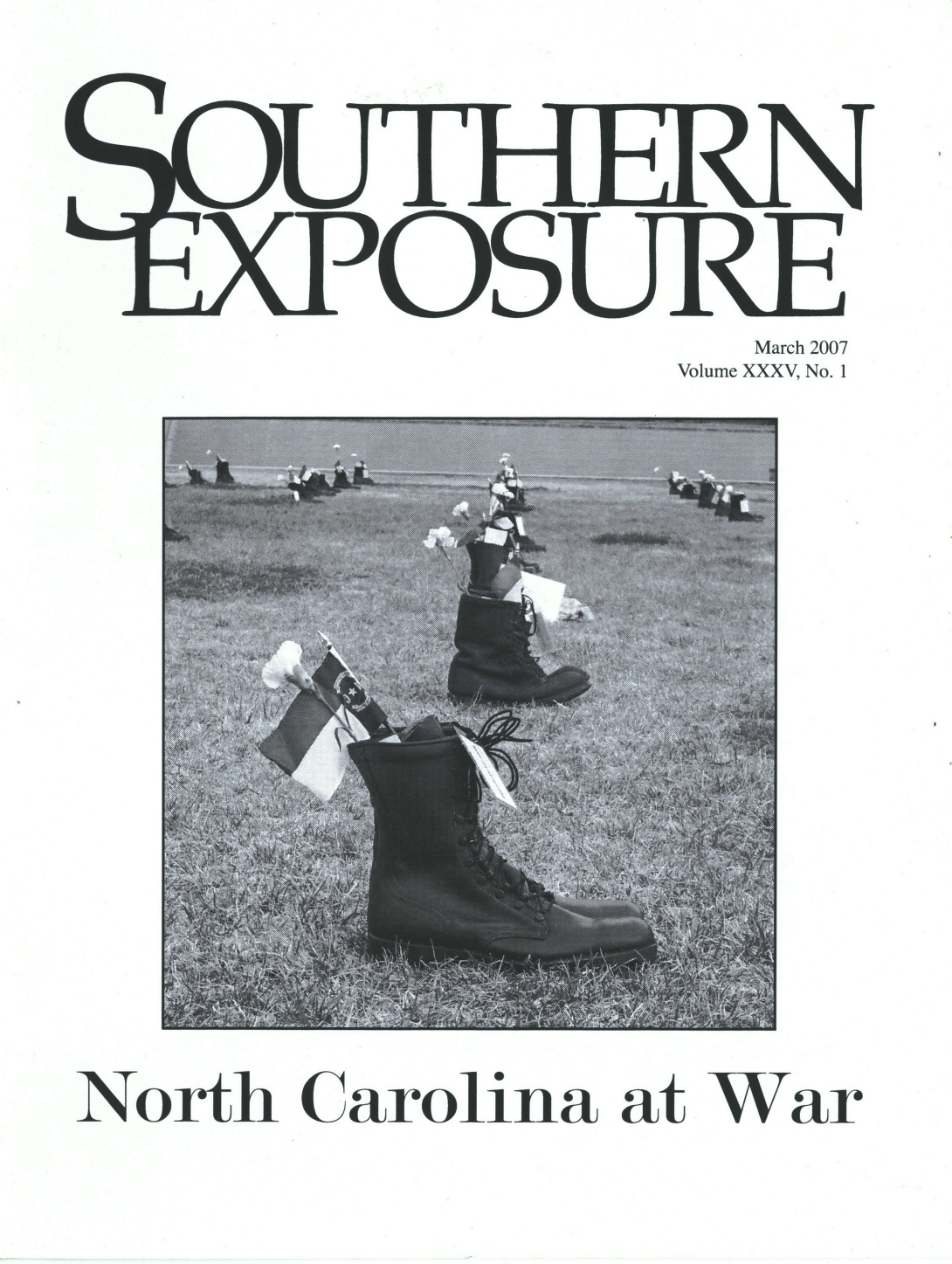 Black and white magazine cover with photo of combat boots in a line with North Carolina flags and flowers in them. Text reads "North Carolina at War"