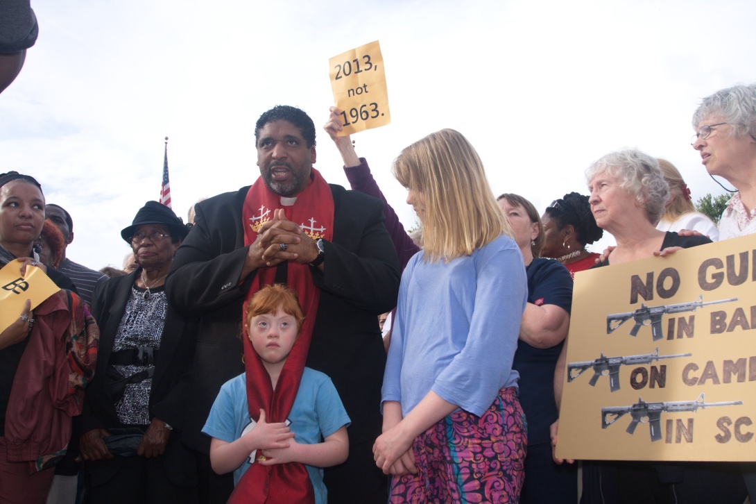 Rev. William Barber amidst Moral Monday protesters